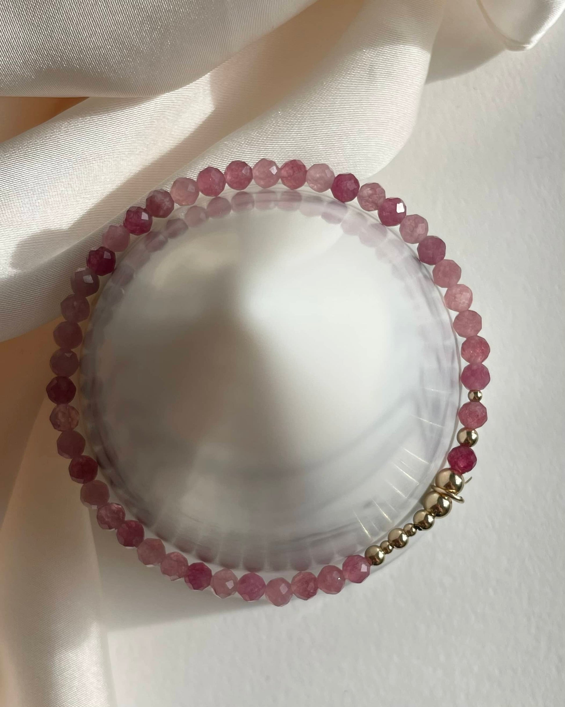 Gold Filled stretch bracelet for October birthstone. Made with natural Pink Tourmaline and a celestial charm.