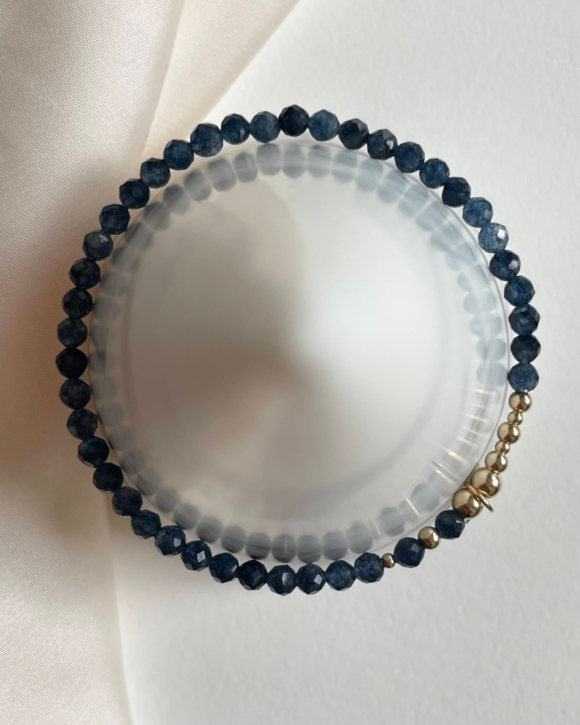 Gold Filled stretch bracelet. Made with blue sapphires. September birthstone bracelet.