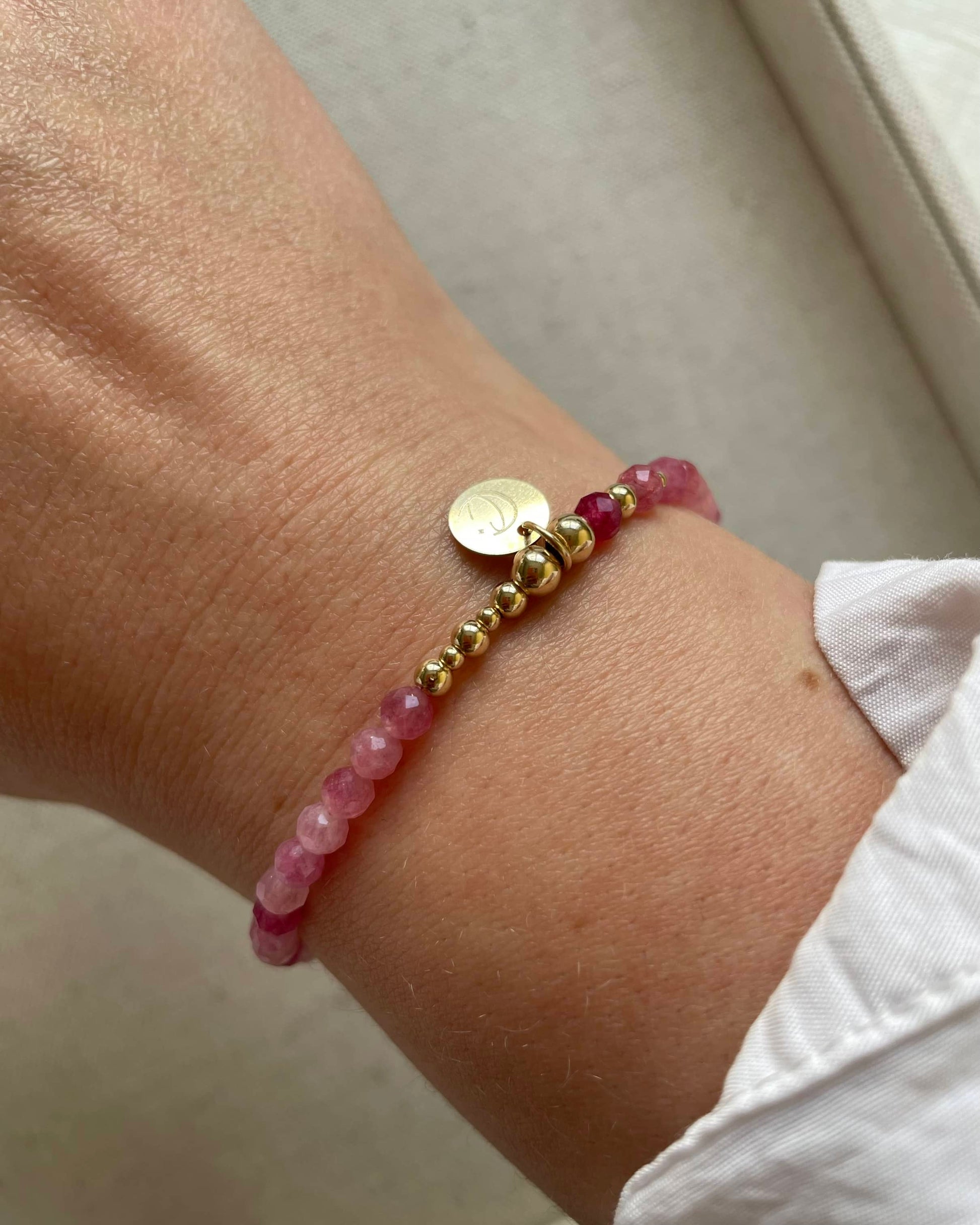 Showing our dainty Pink Tourmaline bracelet on a wrist. Birthstone bracelet for October and Zodiac signs Libra and Virgo.